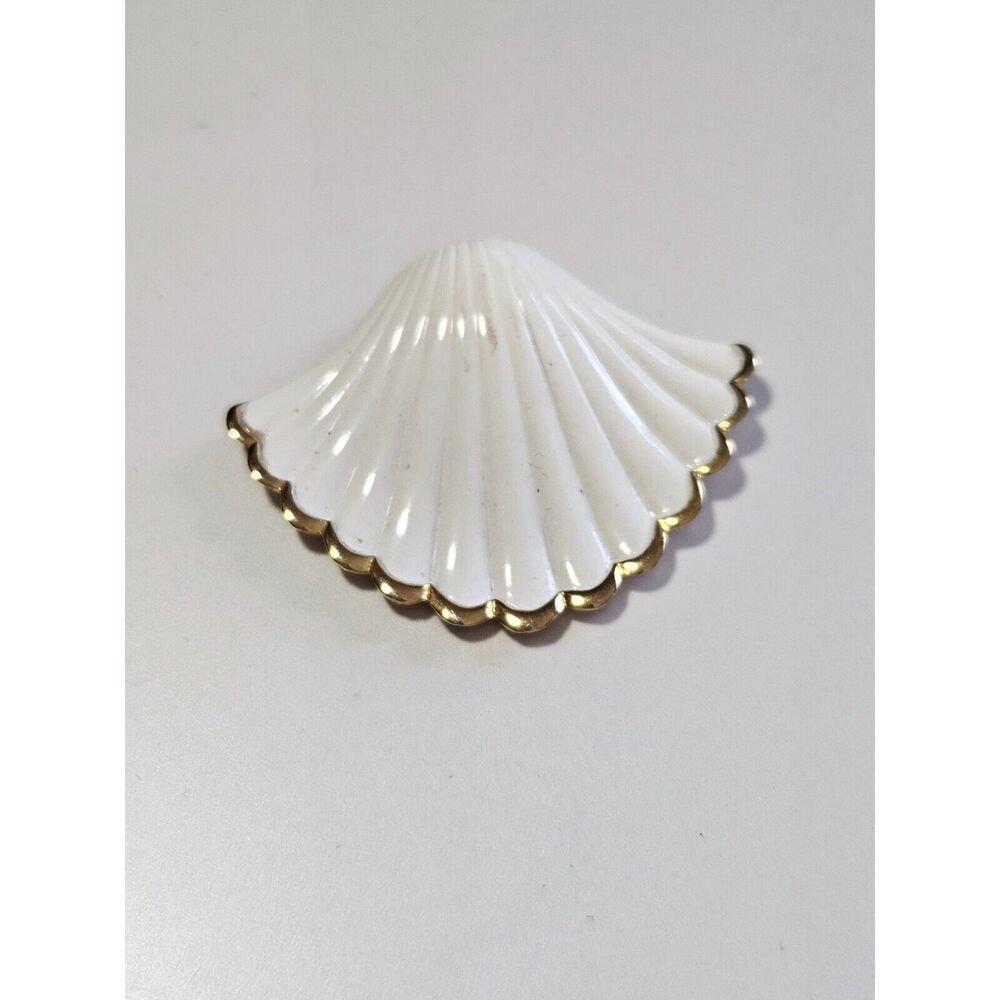 Direction One white and gold tone shell pendant